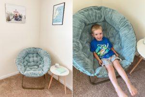 toddler sits in chair of home office